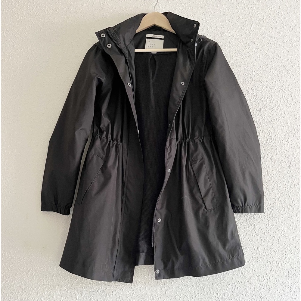 a new day black rain jacket